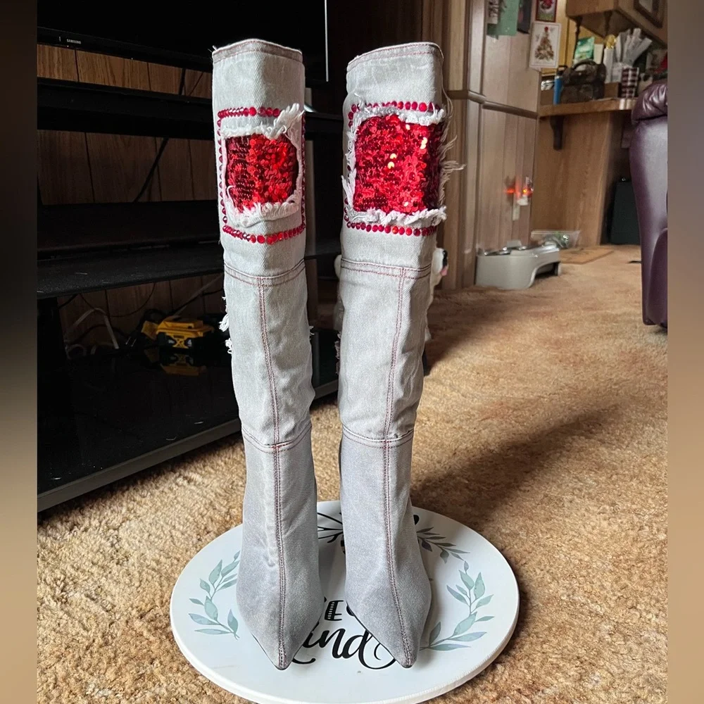 Woman’s multi-color red stone denim pointy toe knee-high boots.